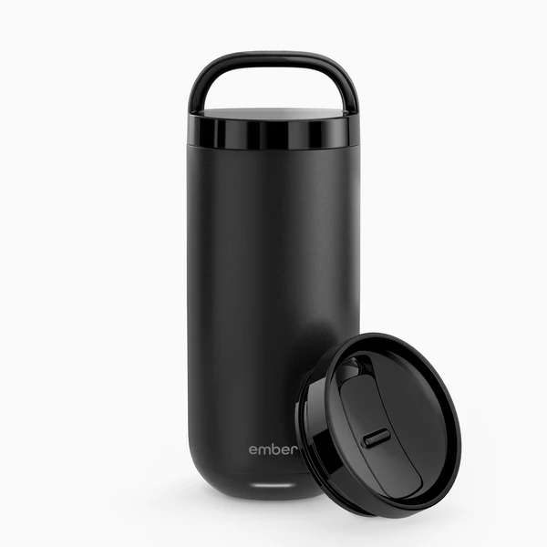 Smart temperature-controlled tumbler on a minimalist desk with morning light